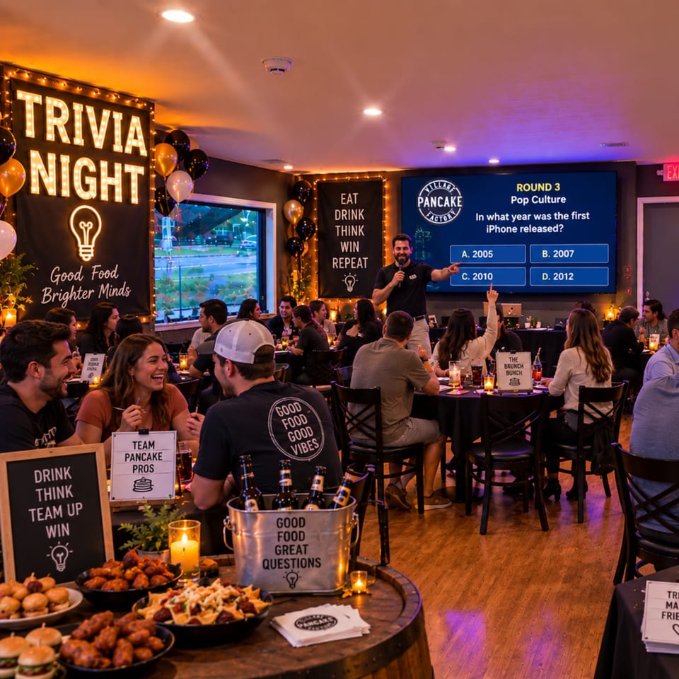 Lively Village Pancake Factory trivia night with a host, cheering diners, plated food, balloons, and a pop-culture quiz screen.